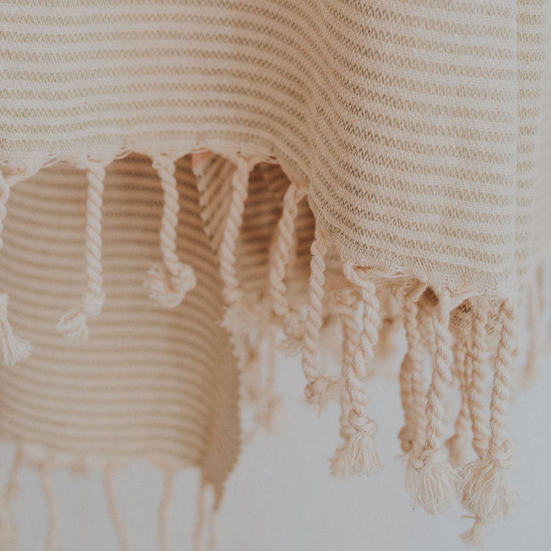 Close up of Bon Ton Studio Flora Turkish Towel in Salmon color