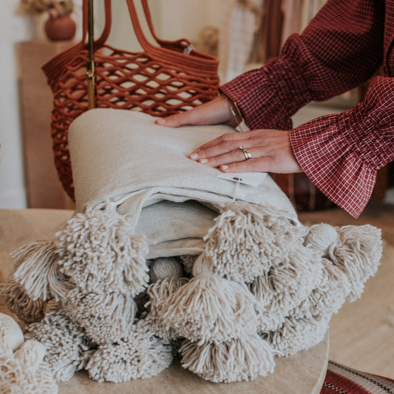 Styled-Home-Decor-Natural-Hand-Woven-Pom-Pom-Blanket-Bon-Ton-Studio